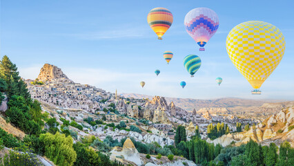 hot air balloons over Goreme town in Cappadocia Turkey
