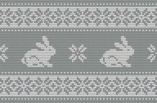 Knitted pattern with rabbits on a gray background. Christmas background. Seamless border. 2023 Year of the Rabbit. Vector illustration