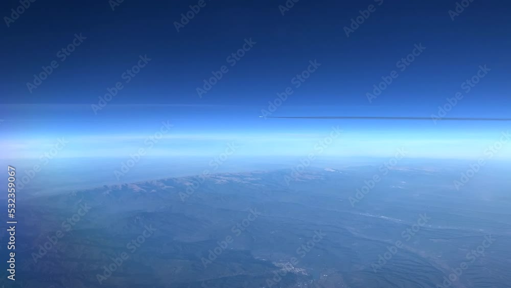 Poster a view from the airplane window flies a plane parallel