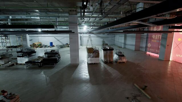 Finishing interior works and equipment installation in large contemporary fashion store time lapse. New boutique opening during weeks