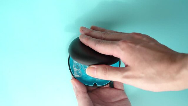 Open the case containing the orthodontic clear aligners for teeth. slow motion video.