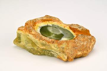 Oval ashtray on uneven yellow stone