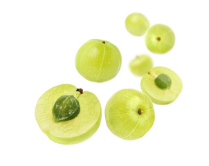  Fresh amla  (Indian gooseberry) fruits with cut in half levitate isolated on white background.