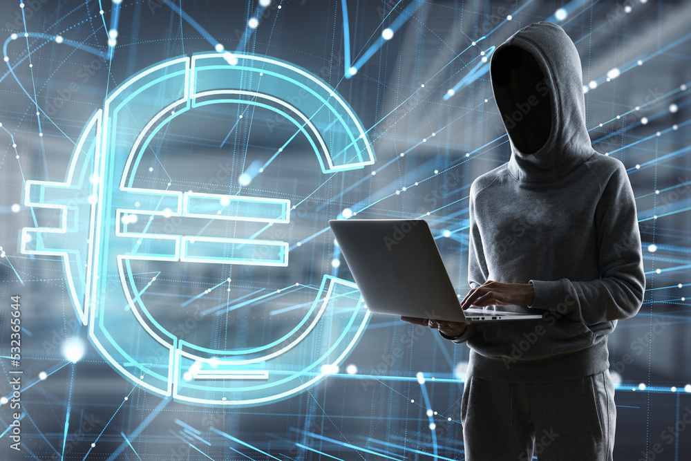Poster hacker in hoodie using laptop with abstract glowing holographic euro sign icon on blurry office inte