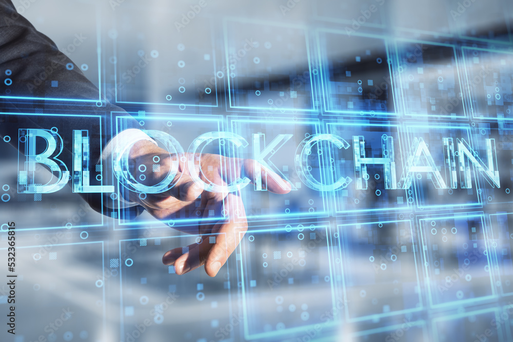 Poster close up of businessman hand pointing at creative blue cubes blockchain text hologram on blurry offi