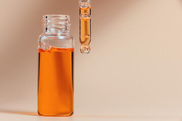 Pipette with a glass bottle on a light background.