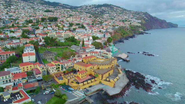 Drone video of Funchal town. Capita city on Madeira island. Madeira, tourism in Portugal, town on the coast in the Atlantic Ocean