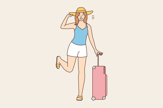 Smiling woman with suitcase ready for travel 