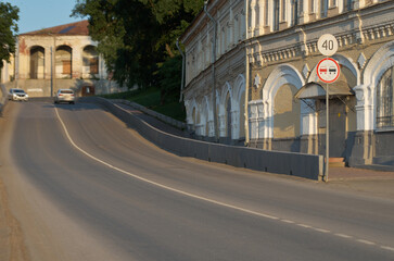Curved road with road signs in small town