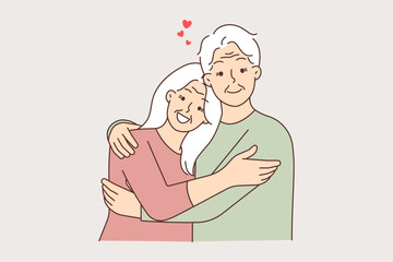 Happy elderly couple hugging