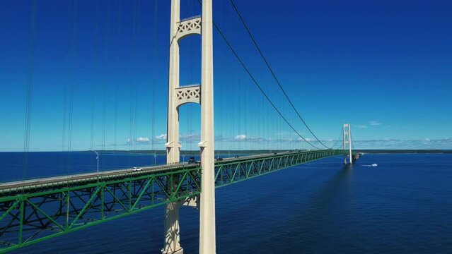 The Mackinac Bridge stretches five miles across the Straits of Mackinac to connect Mackinaw City and St. Ignace, Michigan.  And provides a link between the lower and upper peninsulas of Michigan.