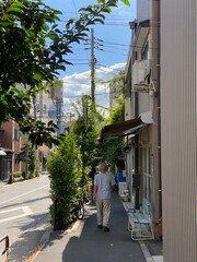 Narrow sidewalk of street in Tokyo downtown “Nezu”, year 2022