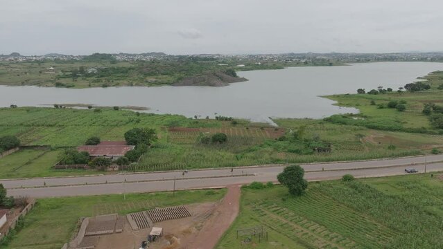AERIAL - Lamingo Dam and highway, Jos Plateau, Nigeria, forward shot