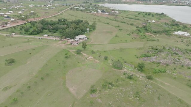 AERIAL - Lamingo Dam at Jos Plateau, Nigeria, forward lowering shot