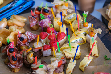 Assortment of party snacks with skewers