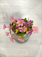 bouquet of flowers in vase on white background