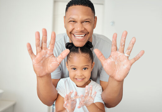 Cleaning, Hand And Happy Family Portrait By Father And Daughter Washing Hands In Bathroom At Home, Relax And Cheerful. Hygiene, Care And Fresh Palms On Parent And Child Enjoying And Playing With Soap