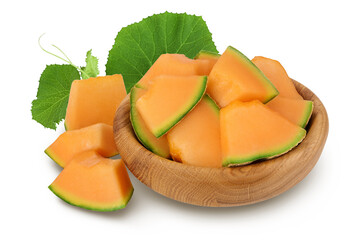 Cantaloupe melon pieces in wooden bowl isolated on white background with full depth of field.