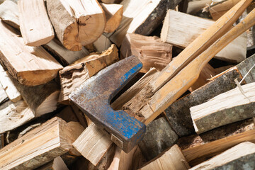 Hatchet Ax and Pile of Split Wood Logs for Fire,