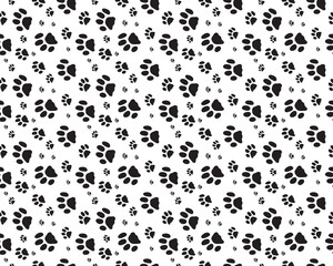 Seamless pattern with print of dogs paws on a white background	