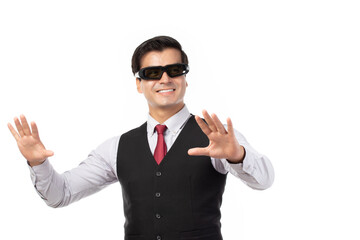 Businessman in a suit with virtual reality VR glasses hand touching virtual global internet connection metaverse on his head isolated on white background.