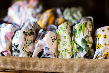 environmentally friendly modern cloth nappy stash of pocket diapers in basket