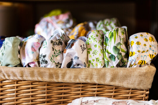 Environmentally Friendly Modern Cloth Nappy Stash Of Pocket Diapers In Basket