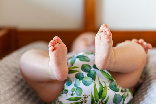 Detail of baby toes and modern cloth nappy - eco friendly lifestyle