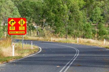 Narrow one lane road sign before Burnett River bridge near Eidsvold, QLD.