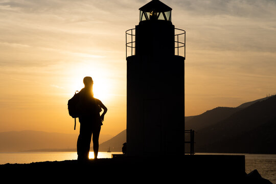 People enjoying Sunset in Camogli, a fishing village and tourist resort close to the peninsula of Portofino, on the Golfo Paradiso in the Riviera di Levante, in Genoa, Liguria, northern Italy - Powered by Adobe
