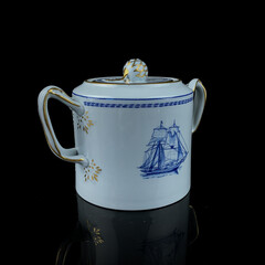 Antique British blue porcelain tea set with ship motifs.antique sugar bowl with ship drawing service closeup