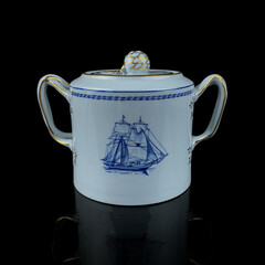 Antique British blue porcelain tea set with ship motifs.antique sugar bowl with ship drawing service closeup