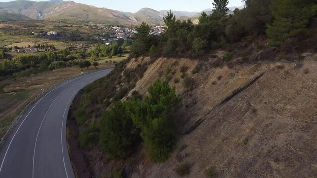 Aerial reveal, flying into a big coal based village, Fabero (Spain)