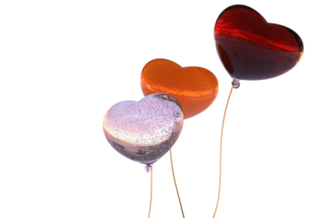 heart shaped balloons on golden string flaming red orange, pale pink bubble glass reflecting sunset on the beach - abstract 3D illustration - isolated
