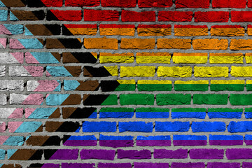 Progress LGBTQ rainbow on a brick wall