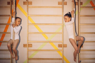 Group of girls exercising at gymnastic school