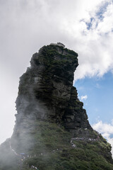 Fanjing Mountain, Guizhou Province, China. Popular travel destinations in China, famous mountains and temples. Holy land of Chinese Buddhism. Vertical image, view from below