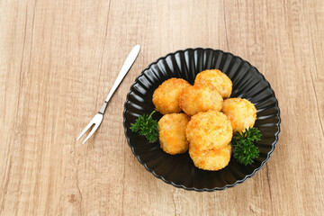Delicious Bitterballen, typical Dutch snacks made from flour, cheese, milk coated with bread crumb filled with mozzarella.
