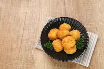 Delicious Bitterballen, typical Dutch snacks made from flour, cheese, milk coated with bread crumb filled with mozzarella.
