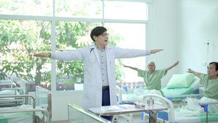 Doctor explaining about medical care and treatment to a group of senior elder patient in hospital...