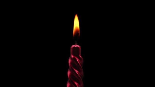 A candle lighting up. Stop motion animation.