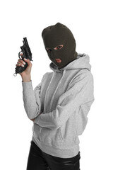Woman wearing knitted balaclava with gun on white background