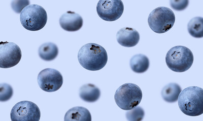 Various falling fresh ripe blueberries on light blue background