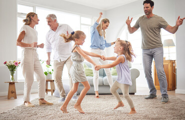 Happy, dance and love with big family in living room together for crazy, energy and excited. Lifestyle, freedom and celebration dancing at modern home with parents, children and grandparents