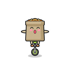 The cute wheat sack character is riding a circus bike