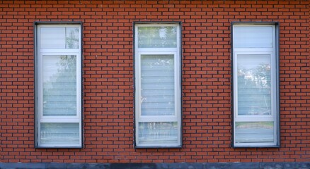 Obraz premium brick wall and windows. frame, facede