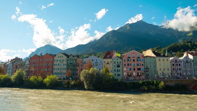 Innsbruck, Austria, Tyrol, Alps timelapse cityscape view from the Inn river looking towards&nbsp;Nordkette with moving clouds.