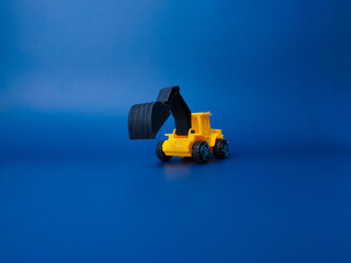 Excavator model isolated on blue background