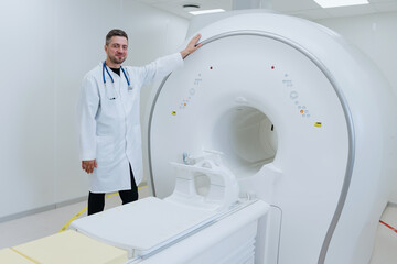 Male doctor stands next to a professional MRI. Diagnostic room in the clinic.