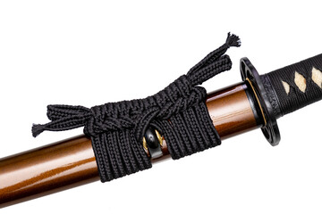 Black color Sageo - Japanese sword sheath rope made of high quality silk isolated on white background. Selective focus.